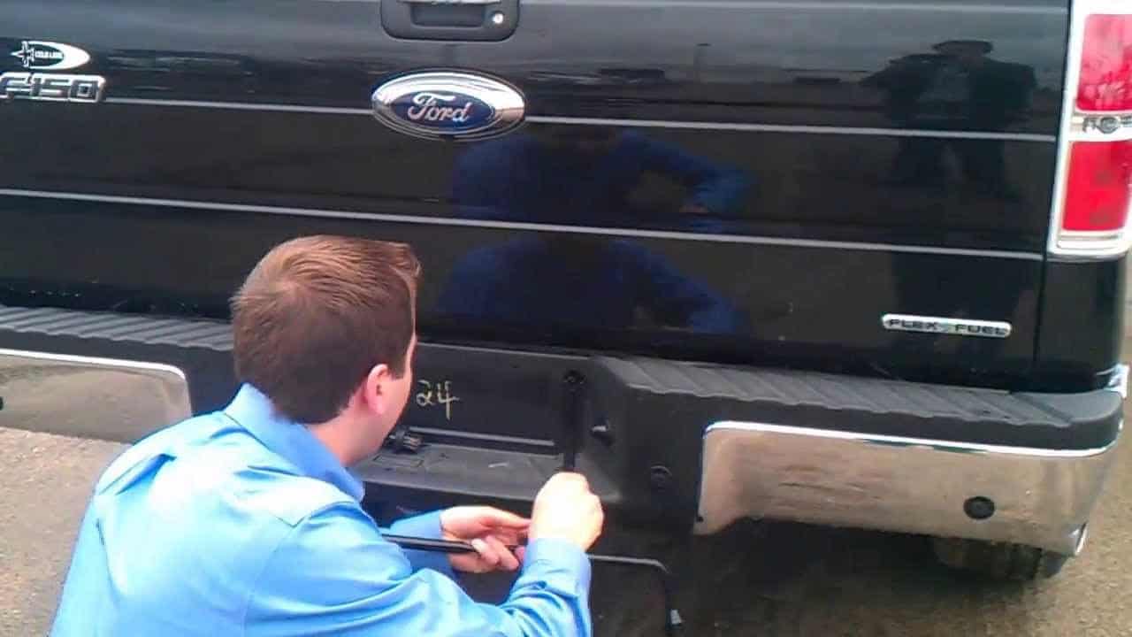 Takedown the spare tire of Ford car